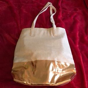 Never used, tang and gold tote.